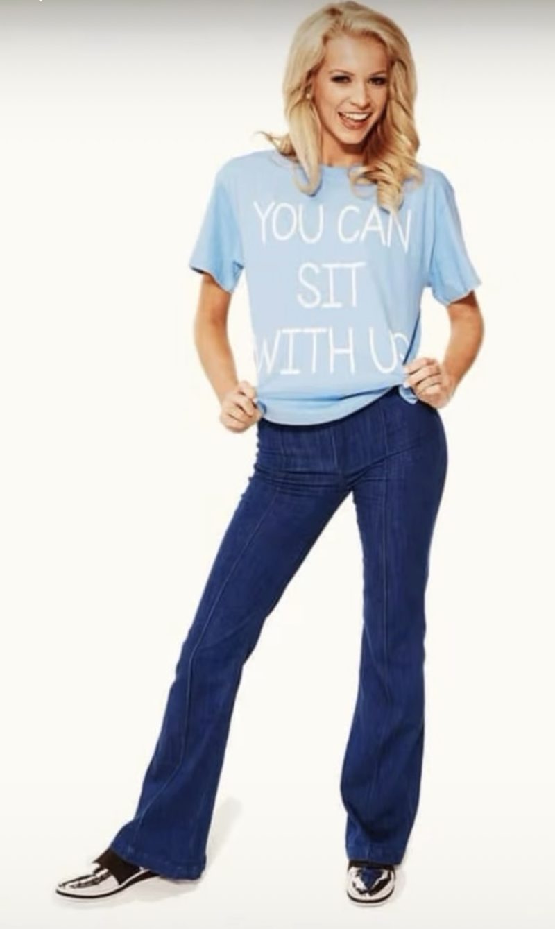 Founder Anna Claire Hay wearing a You Can Sit With Us t-shirt